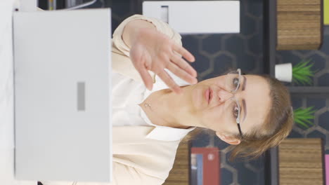 Vertical-video-of-Business-woman-saying-stop-to-camera.